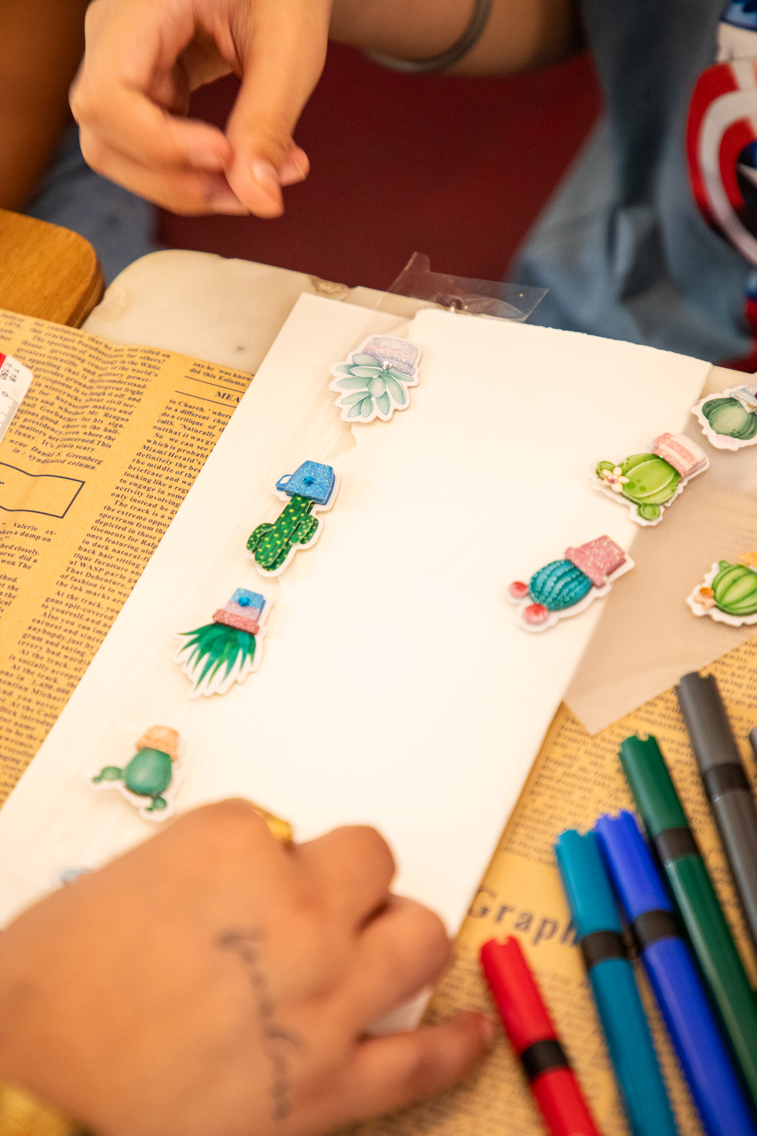 Craft supplies and sticker sheets in progress